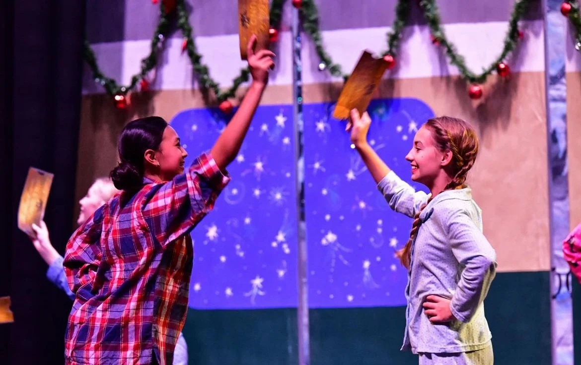 Weehawken children holding performance tickets