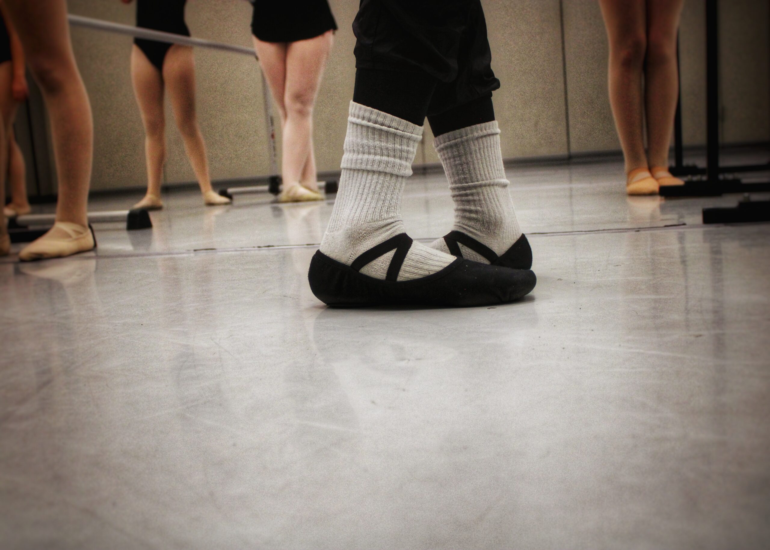 dancers standing in ballet shoes